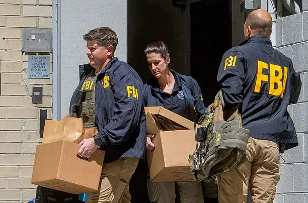 FBI raids on Bolton's Washington, D.C., office and Bethesda, Maryland, home